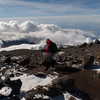 Hiker at the summit of Kilimanjaro