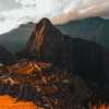 Machu Picchu bathed in orange light