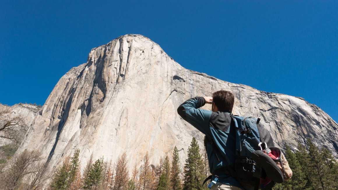 Climber looking up at el capitan
