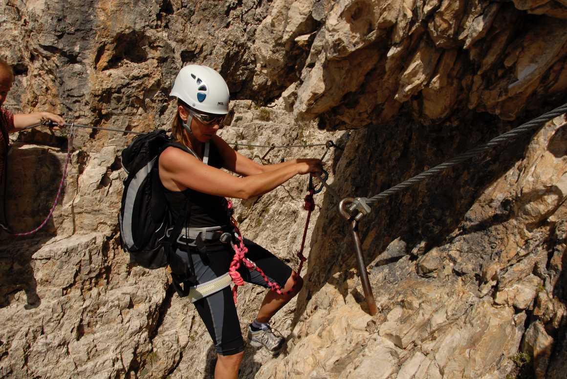 Climber using via ferrata in Italy