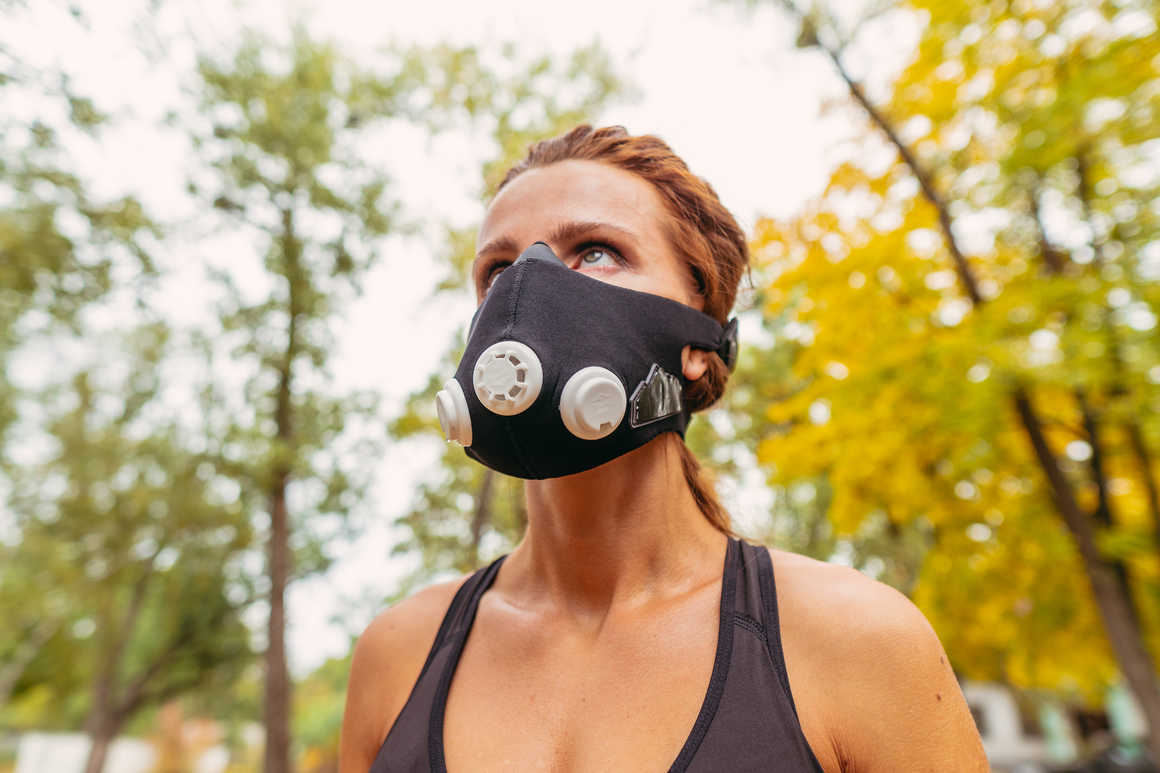 Female athlete with altitude training mask