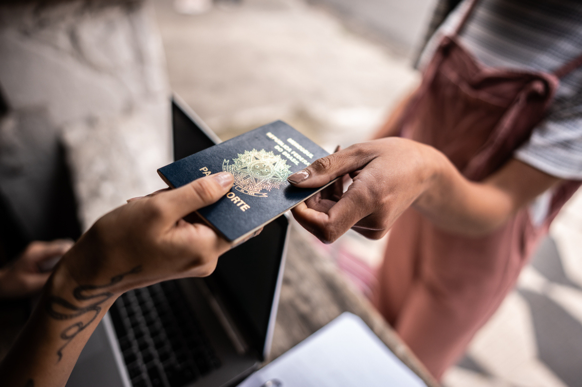 handing over passport to be checked at immigration