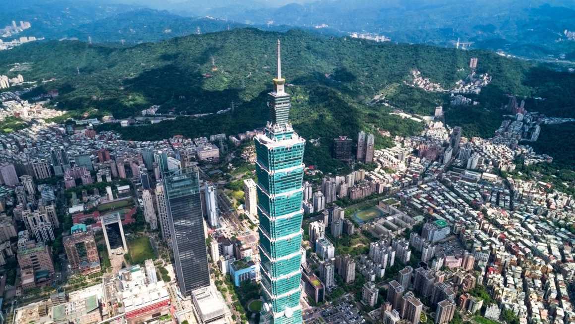High  view of Taipei 101 and the surrounding city and mountains