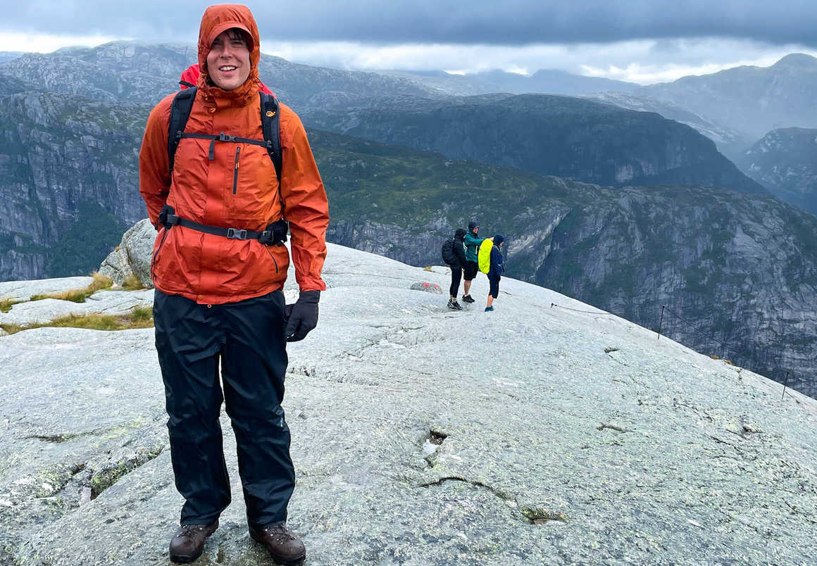 Hiker in waterproof gear after downpour on Kjeragbolten hike in Norway