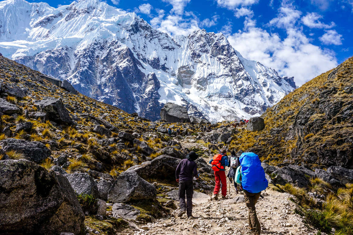 Hikers cimbing to the Salkantay pass