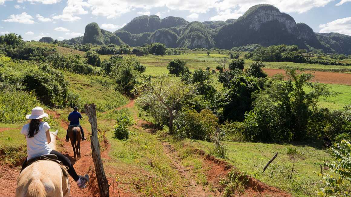 Horseback riding in the tropical valley of Vinales, Cuba