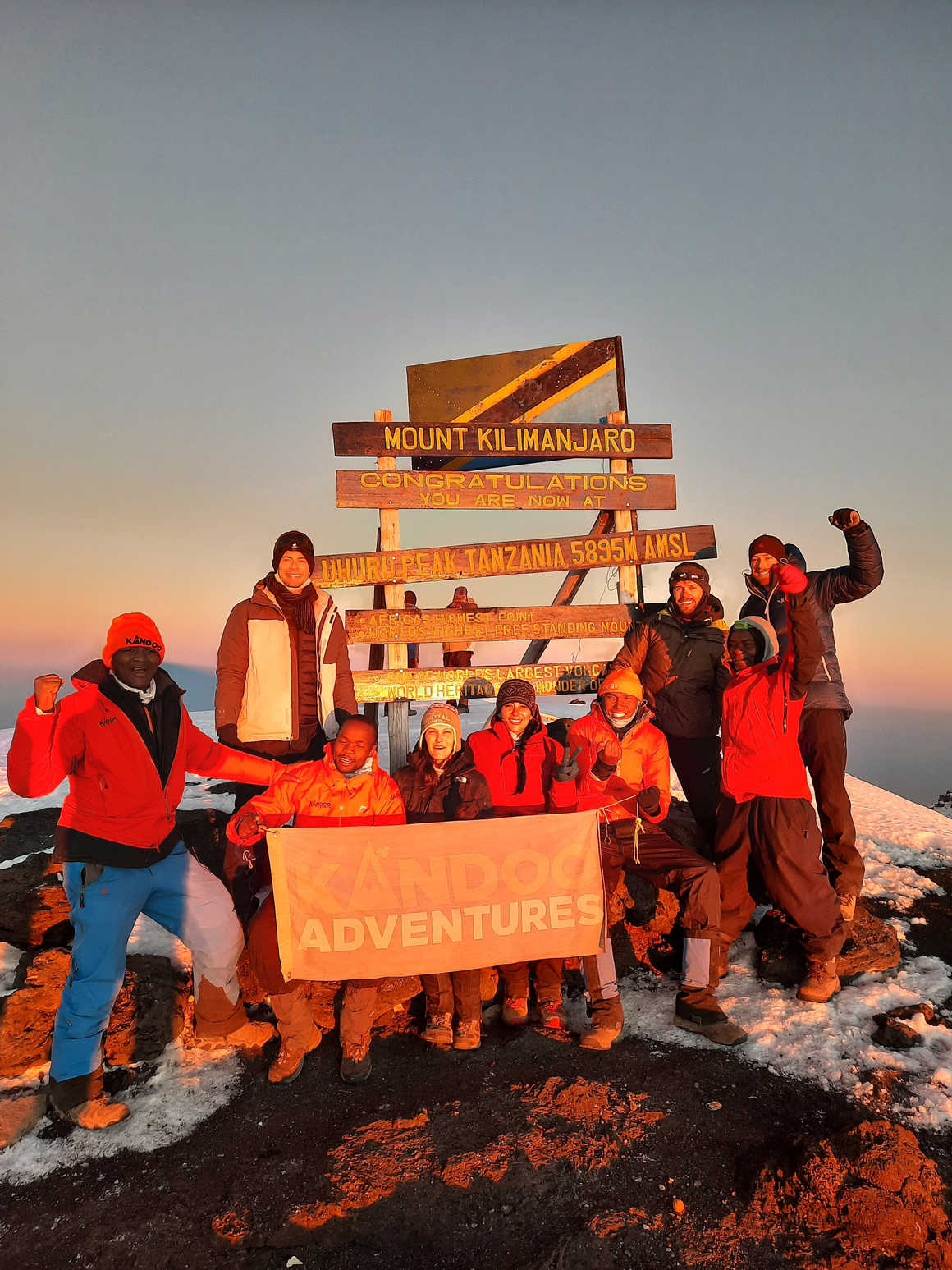 Kandoo guides and climbers on the summit of Kilimanjaro