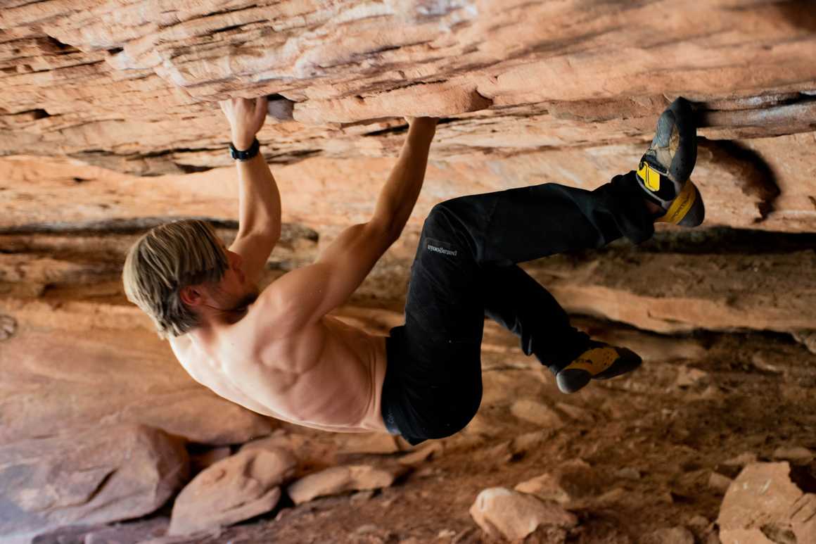 Man free solo climbing in Moab USA