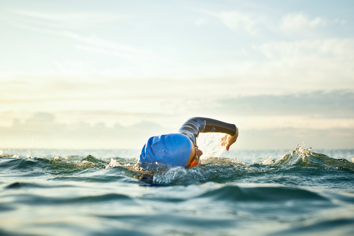 Man swimming in the open sea