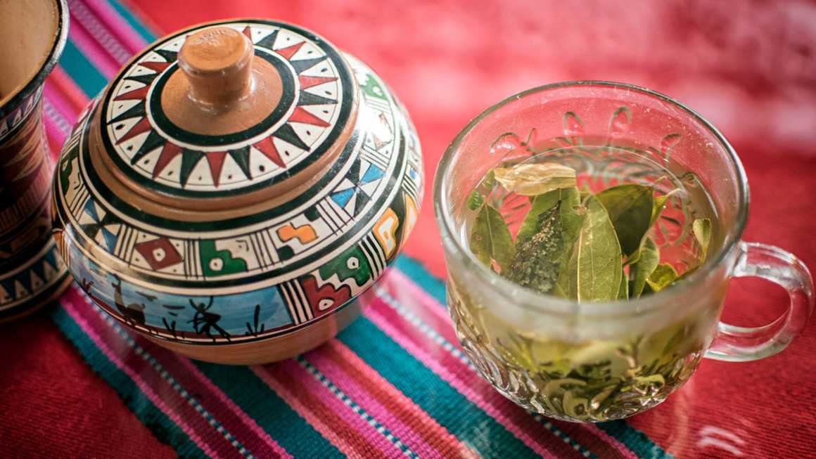Mate de coca (coca tea) in a glass mug