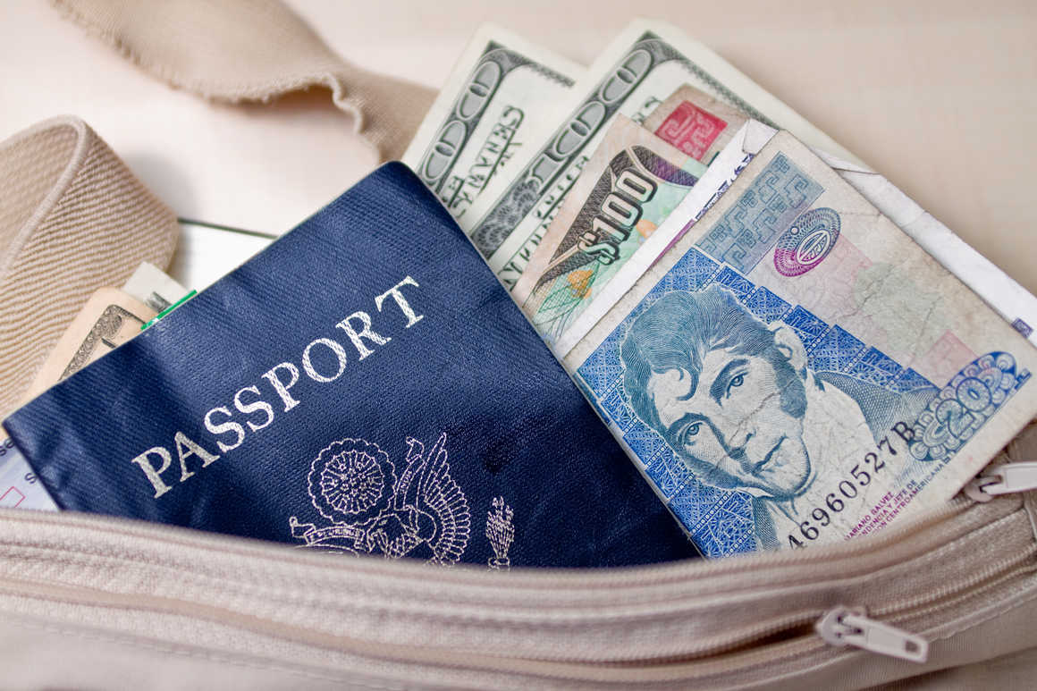 Money and a passport in a money belt