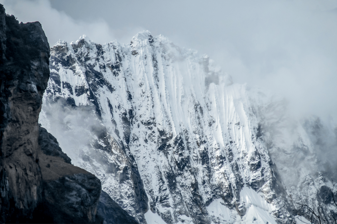 Mountain landscape of Huascarán National Park in Peru with towering snow-capped peaks.