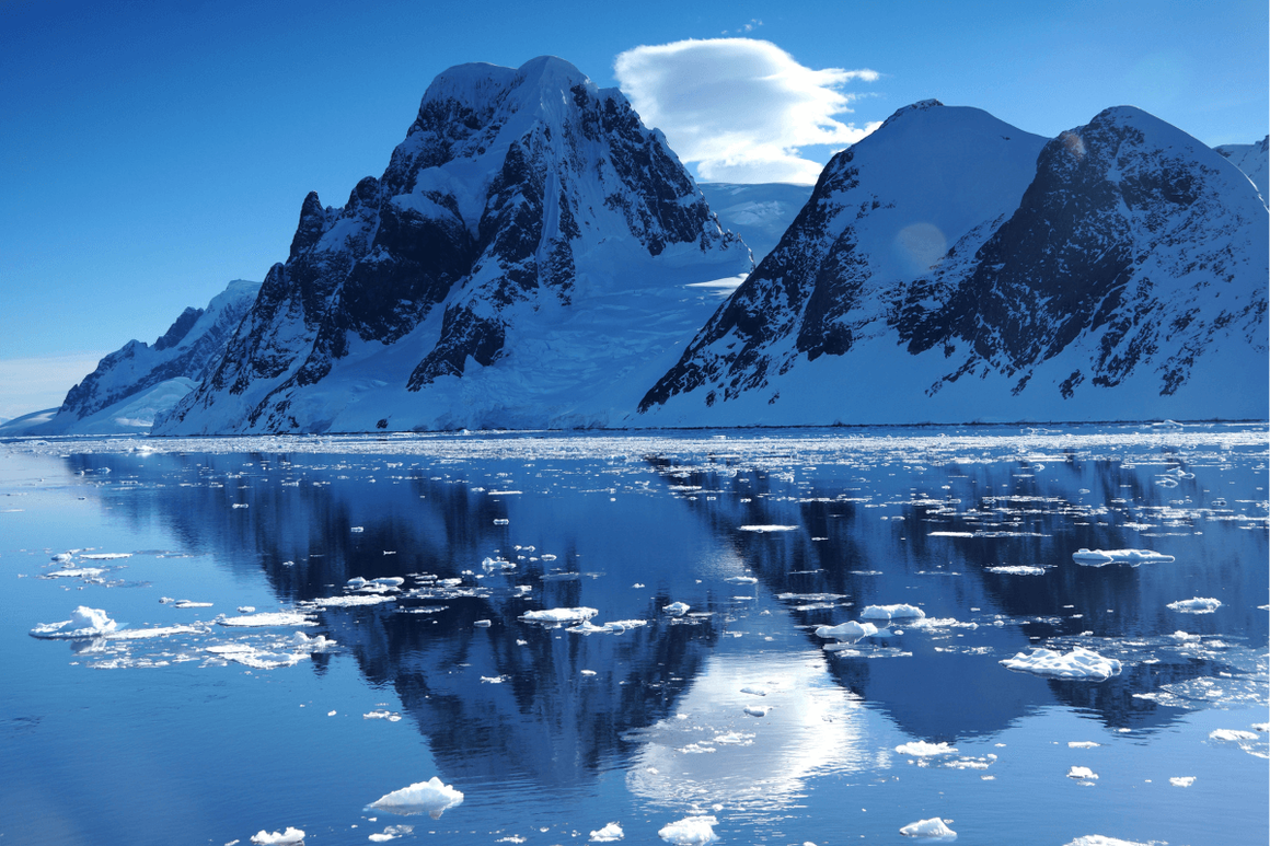 Mountains of Antarctic reflected in calm water