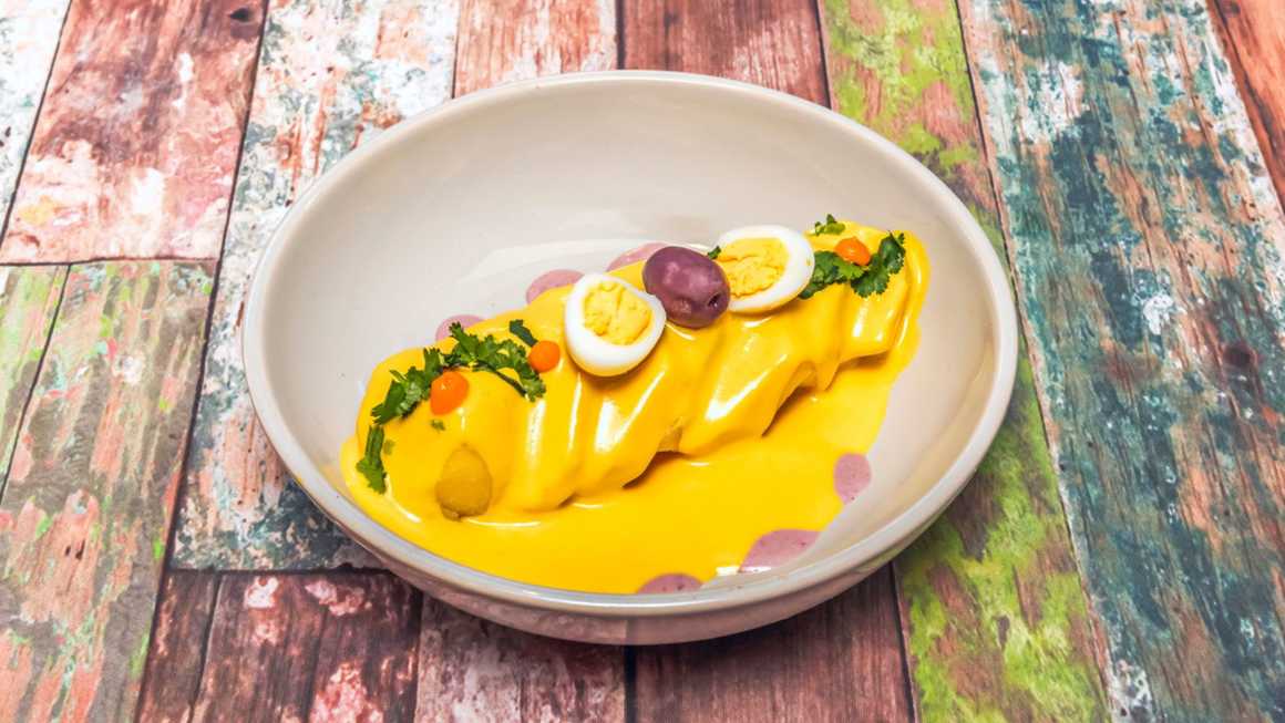 Papa a la huancaína plated with garnish