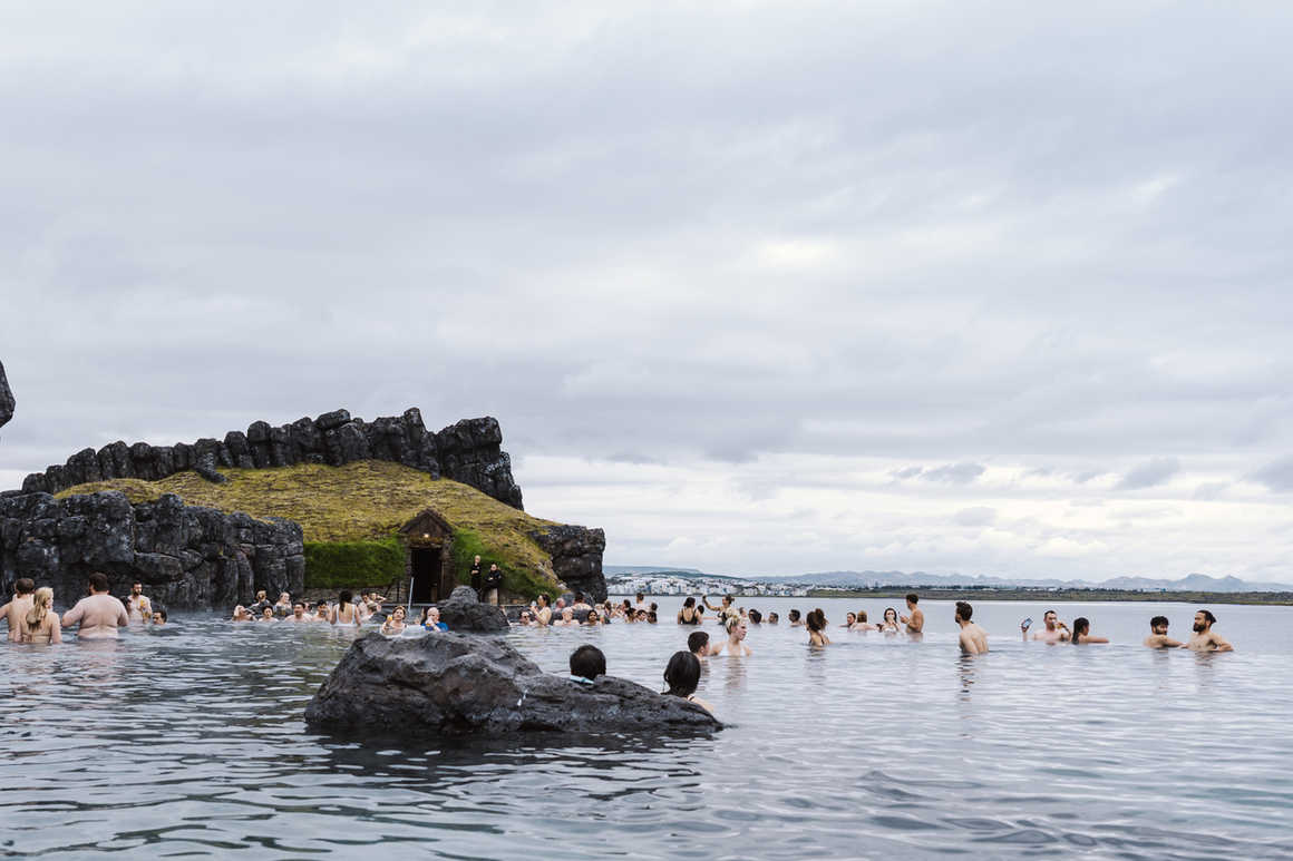 People swimming in Sky Lagoon in Iceland