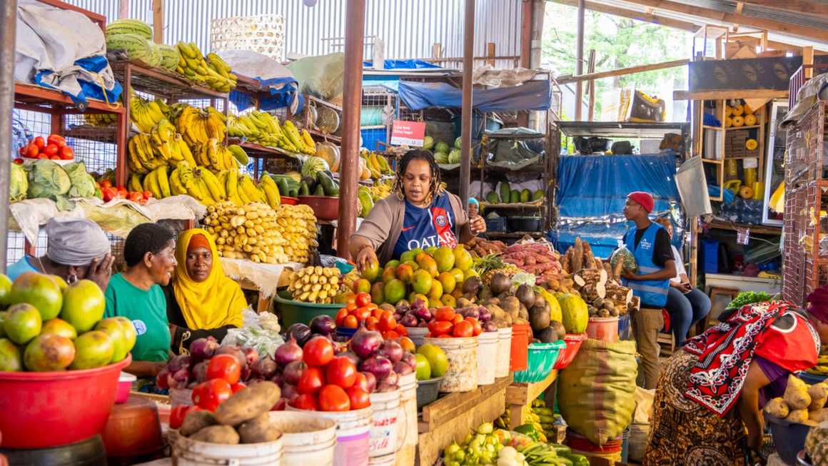 People working at a Tanzanian food market