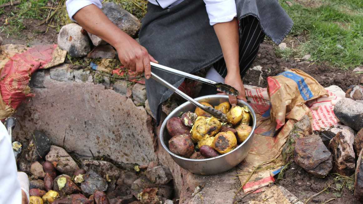 Peruvian chef preparing Pachamanca