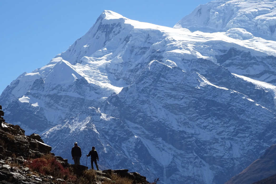 Silhouette of hikers in Annapurnas II