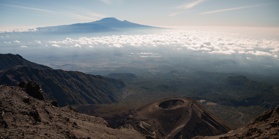 The view of Mount Kilimanjaro from Mount Meru, separated from each other by clouds