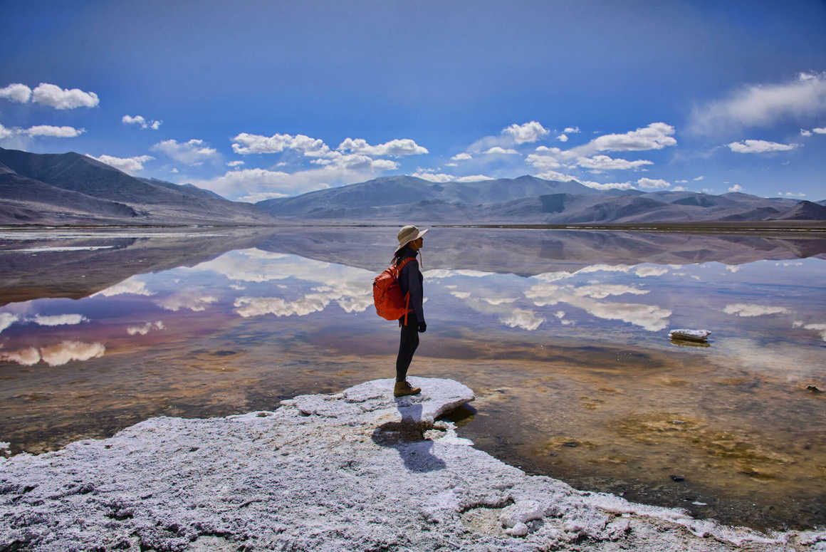 Trekker enjoying the view of Tso Kar Lake, Ladakh, India