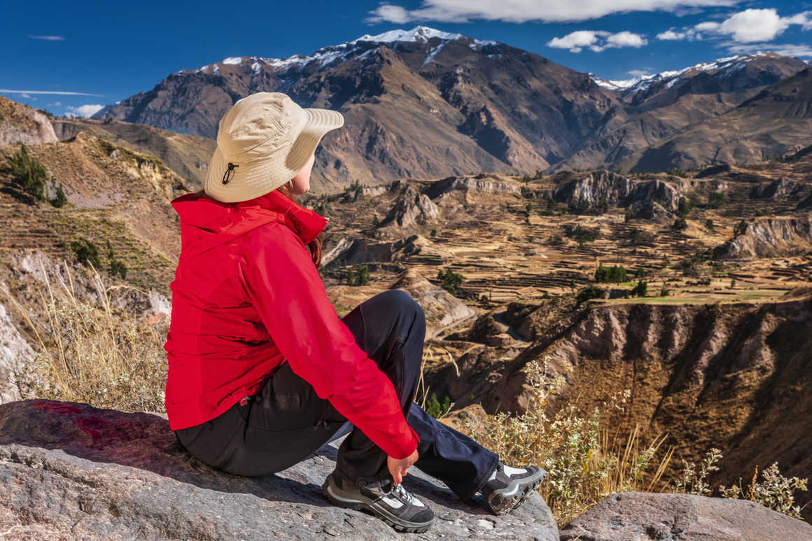 Trekker Looks Over Colca Canyon, Peru