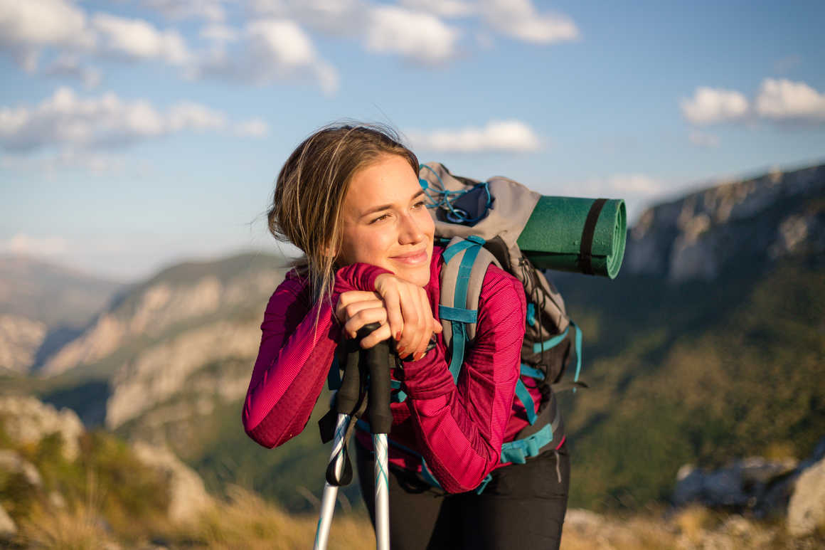 Woman with trekking poles