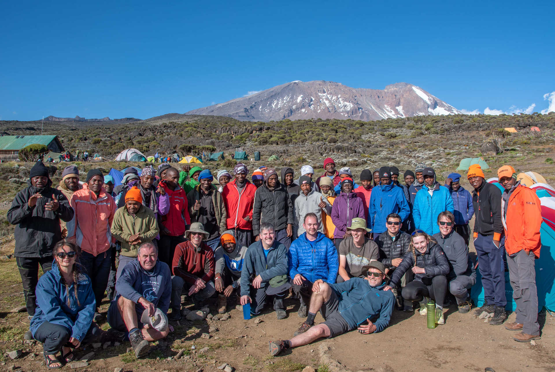 A Kandoo Adventures group with support team at Shira Cave Camp on Kilimanjaro