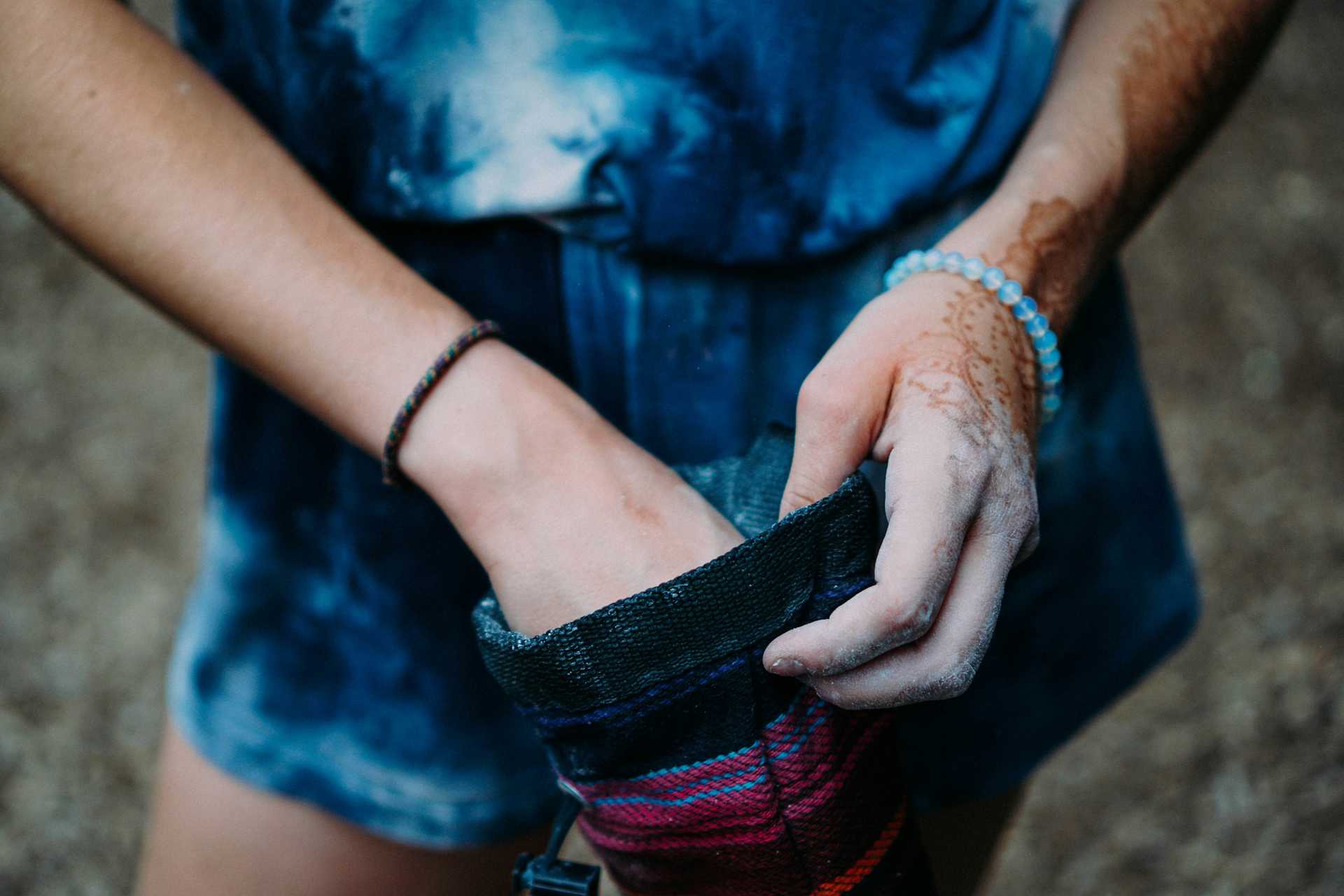 Female climber with climbing chalk bag