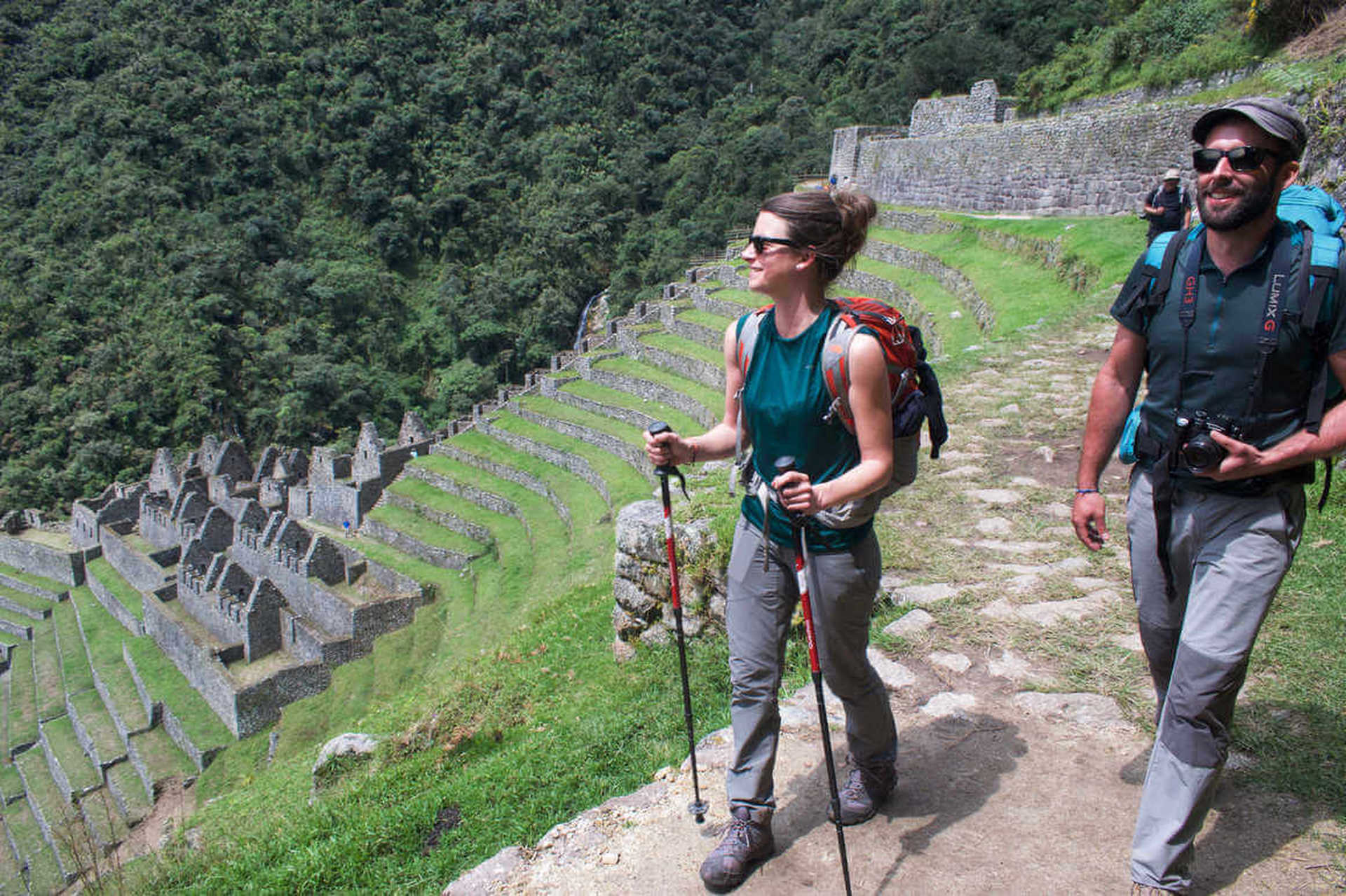 Hikers in Inca ruins in Peru on the Inca Trail