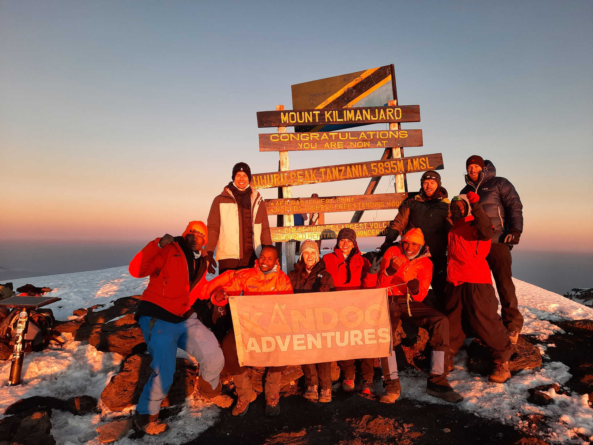 Kandoo guides and climbers on the summit of Kilimanjaro © Kandoo Kandoo guides and climbers on the summit of Kilimanjaro