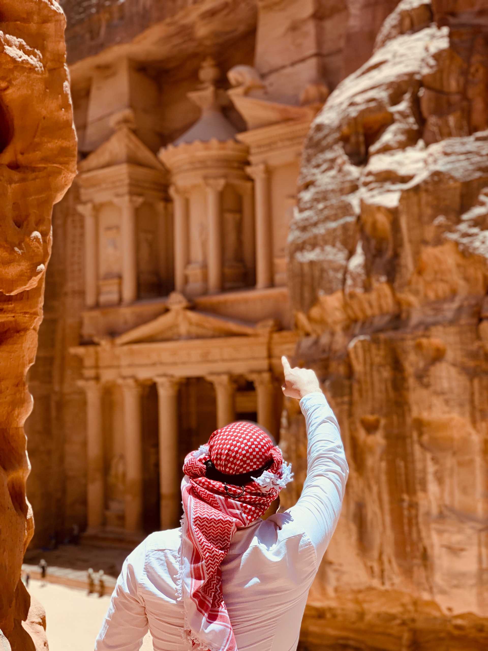 Man pointing at Petra