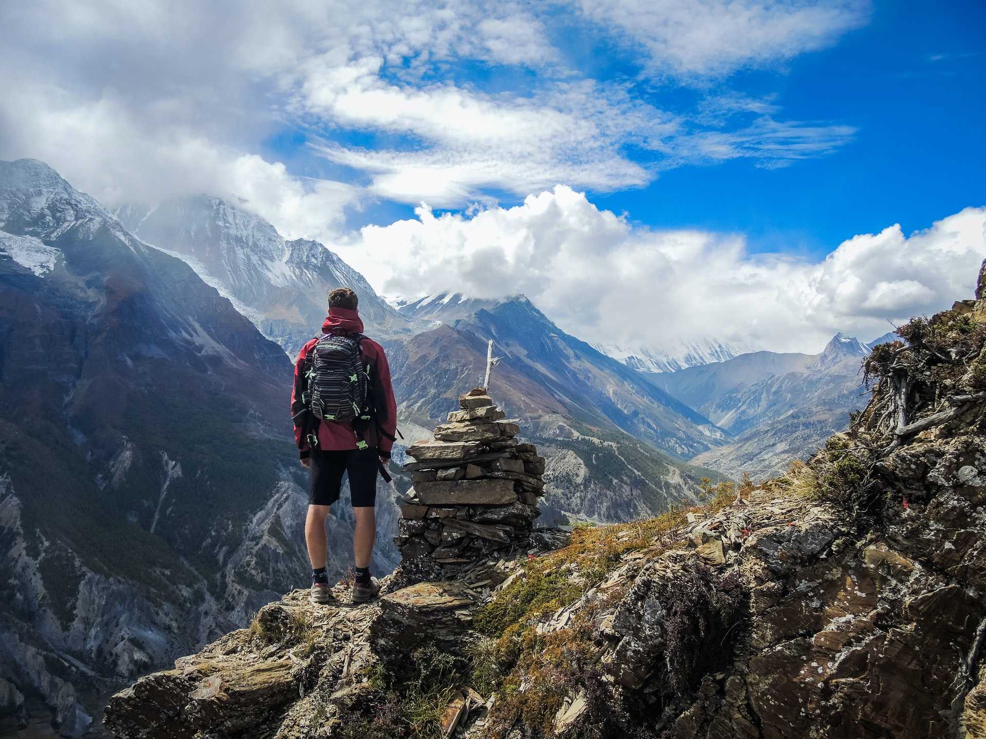 Man Standing on Peaks in Patagonia