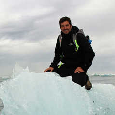 Peter sitting on a iceberg in Norway