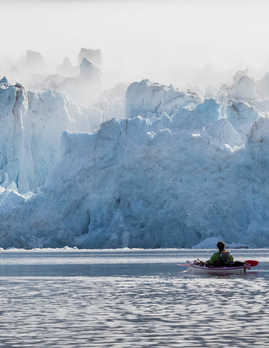 Kayaking near glacier in Spitsbergen, Svalbard