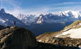 Hiker in front of the Mont Blanc massif