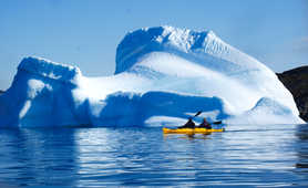 Sea kayaking among icebergs