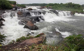 Water falls across rocks in the River Nile in Uganda