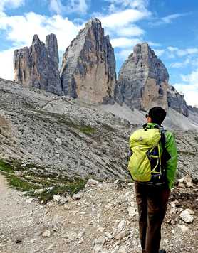 Hiker in front of the Tre Cimes, Dolomites