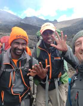 Sam Holland at Kilimanjaro with Guides