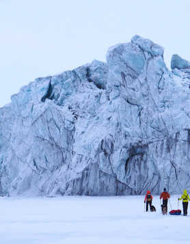 Skiing on ice floe in Spitsbergen at the foot of glacier