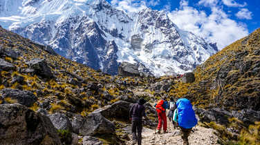 Hikers cimbing to the Salkantay pass