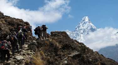 Hikers in front of Ama Dablam
