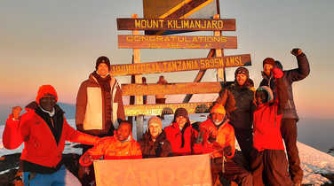 Kandoo guides and climbers on the summit of Kilimanjaro