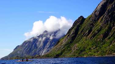 Paddling-around-the-headland-towards-Nusfjord