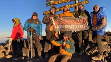 Sam Holland at Kilimanjaro Summit with group