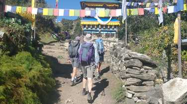 trekking-beneath-fluttering-prayer-flags