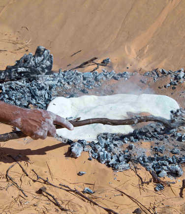 Baking bread in the desert sands of the Sahara