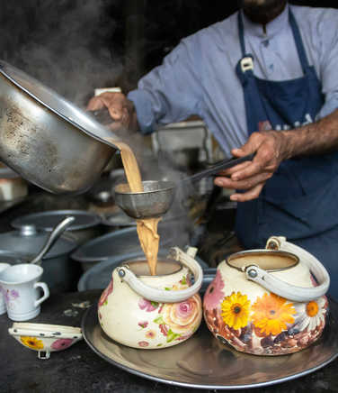 Chai being poured into pots