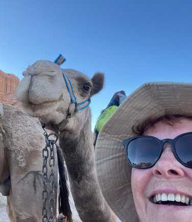 Happy Kandoo traveler with camel