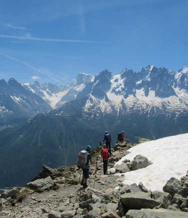 Hikers in front of the Mont Blanc massif